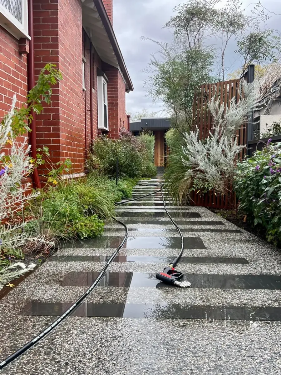 Poli Clean exterior cleaning — freshly cleaned brick entrance and walkway